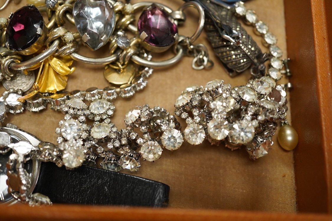 A quantity of assorted antique and later costume jewellery to include a silver and Marcasite ladies fob watch, a collection of cufflinks, brooches and a pair of drop earrings with screw backs